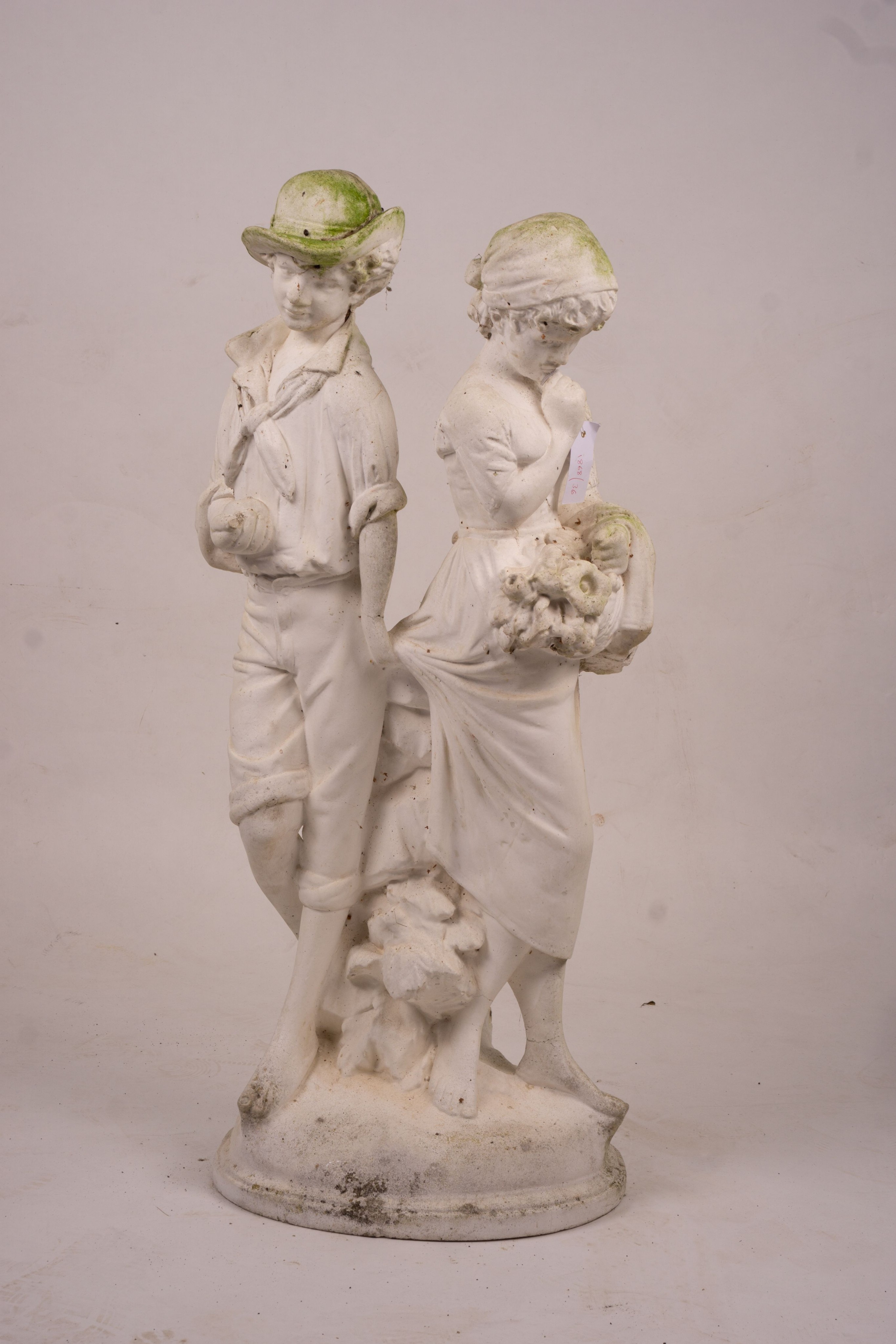 A reconstituted stone garden ornament of fruit and flower pickers, height 89cm